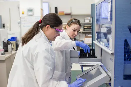 2 med techs working in blood bank